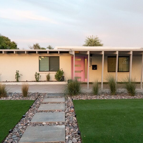 Ralph Haver mid-century modern home in Marlen Grove Phoenix with pink front door, patio port, low roofline, clerestory windows, and desert landscaping.