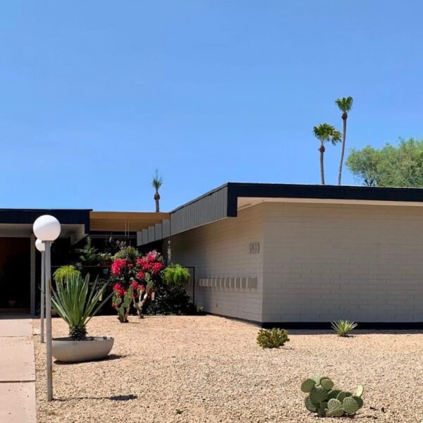 Al Beadle mid-century modern home in Paradise Gardens Phoenix with carport, low roofline, block exterior, desert landscaping, cactus, and palm trees.