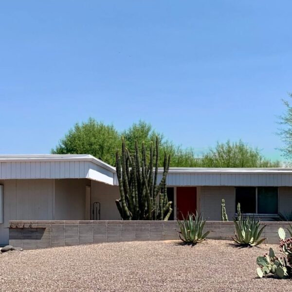 Al Beadle mid-century modern home in Paradise Gardens Phoenix with red front door, low roofline, cactus landscaping, block wall, and desert modern design.