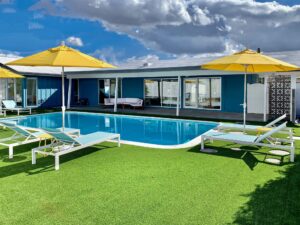 Backyard pool and outdoor living area after renovation at the Sheridan House in Scottsdale, Arizona.
