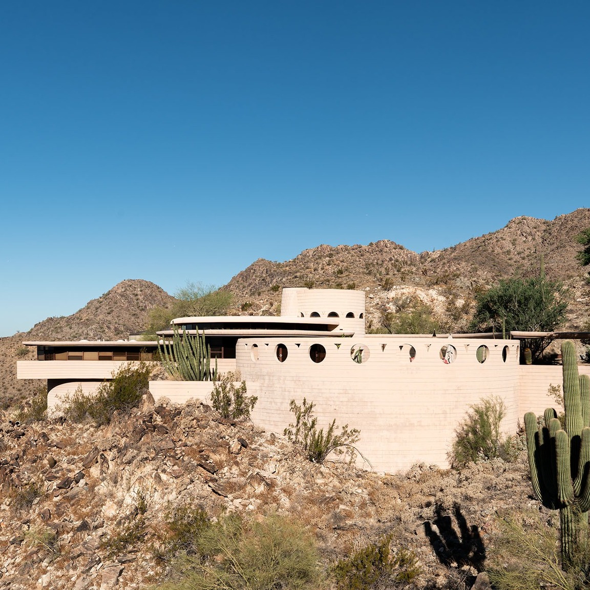Frank Lloyd Wright never designed neighborhoods in Phoenix.

But his influence is everywhere.

The materials.

The conne